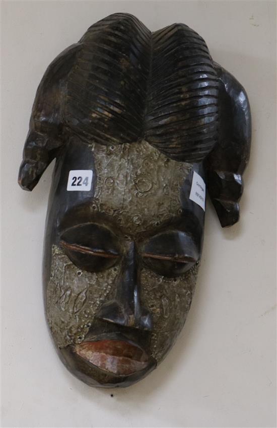 A Gabon metal overset carved wood mask length 40cm